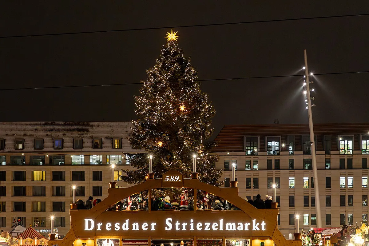 The tall Christmas pyramid above the Striezelmarkt stalls on Dresden's Altmarkt — 1